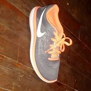 Nike neon orange and gray shoes